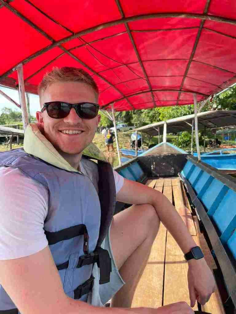 Simon from Sculpt websites wearing a life jacket, whilst taking a boat ride in Thailand
